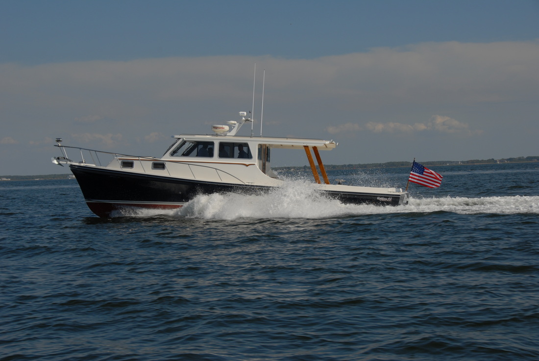A boat with a flag similar to American flag