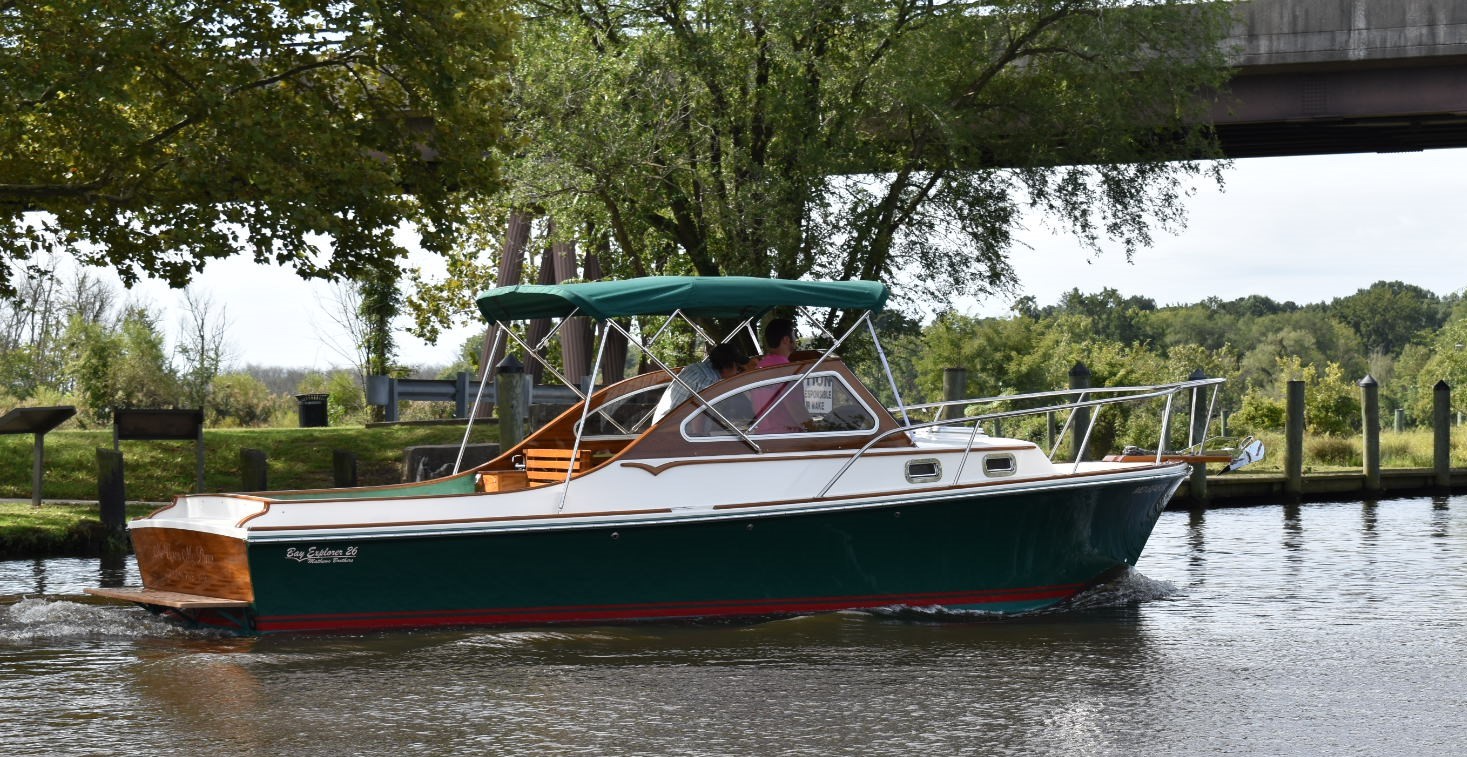 A Boat With Green Shade by the Lake Shore